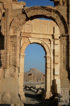 Arches, pillars and castle of ruins in Palmyria Syria.